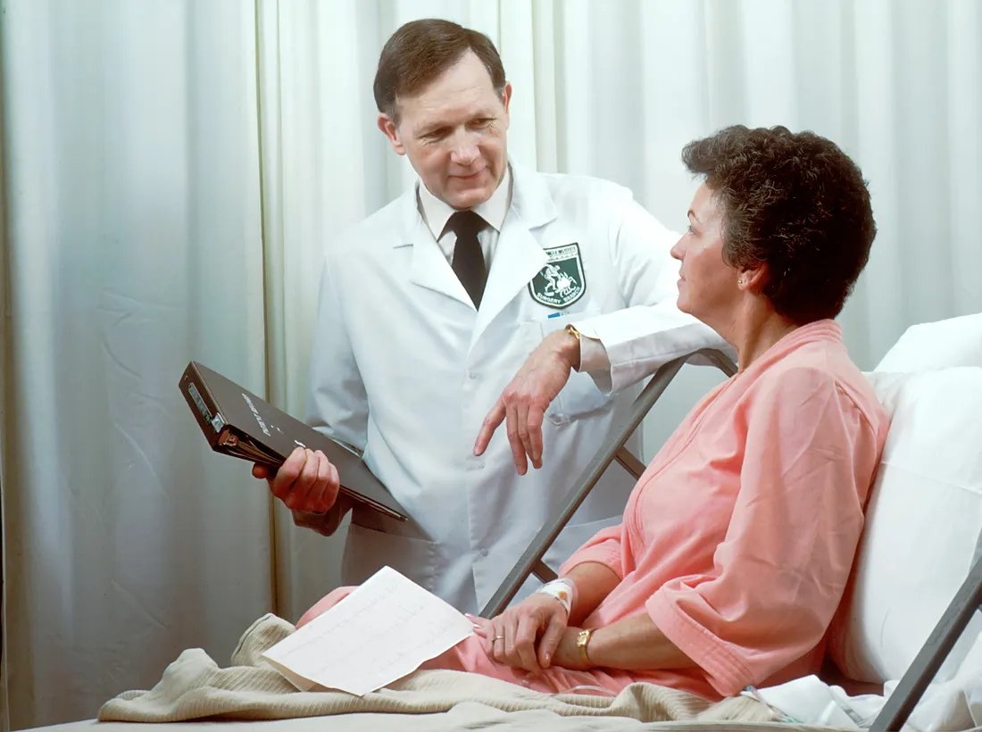 A physician consulting with a senior patient about integrative eye care